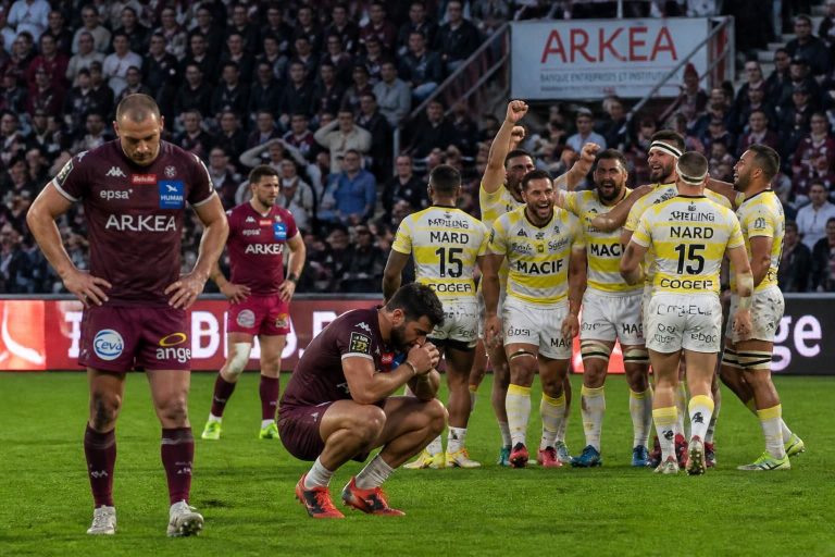 dramatic rugby showdown as bordeaux-bègles are eliminated from the top 14, while la rochelle secures their place in the playoffs with a thrilling victory.